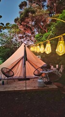 A luxury glamping hotel tipi tent experince with cosy details and interior design 
