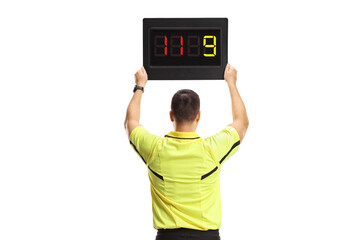 Football referee holding a substitute board