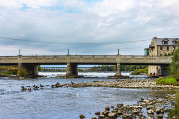 View of the Park Hill Road Bridge and the Dam in Grand River, from the Mill Race Park, Cambridge, Galt, Ontario, Canada
