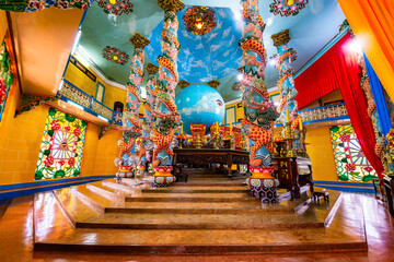 Cao Dai temple area and meditating followers of the Cao Dai religion in the temple Cao Dai, Tay...