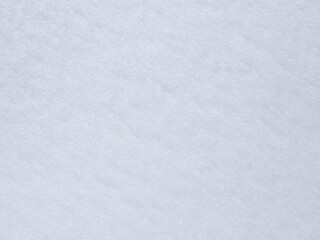 Obraz premium Natural snow texture. Smooth surface of clean fresh snow. Snowy ground. Winter background with snow patterns, Closeup top view, Freshly fallen white snow a background, Snowy white texture, Snowflakes.