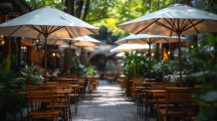 Outdoor cafe with wooden tables and chairs under white umbrellas.