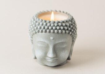 Handcrafted Buddha Head Candle with Flickering Flame - A Symbol of Peace and Serenity. Selective...