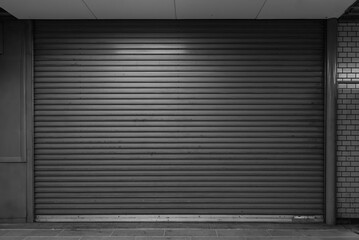 Old rusty closed steel doors for dark steel metal store door backgroud and texture.