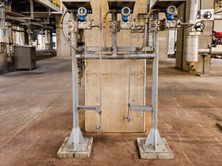 Three pressure transmitters are mounted on a wall