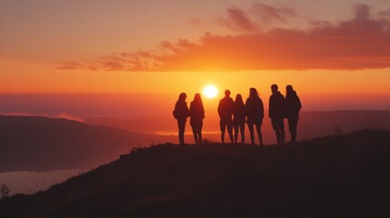 Group of friends watching the sunrise from a hilltop, capturing excitement and new beginnings