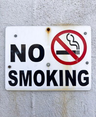A No Smoking Sign which is widely recognized as a safety sign used to indicate areas where smoking...