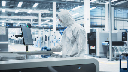Printed Circuit Board Production At Electronics Factory: Scientist In Sterile Suit Using Soldering...
