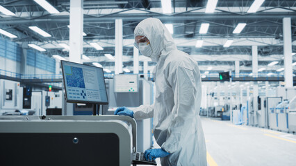 Printed Circuit Board Production In a Factory Research Center: Scientist In Sterile Suit Using...