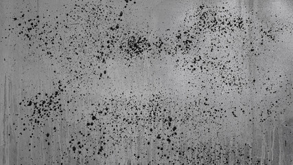 gray background, on a gray wall with streaks, splashes and strokes of paint