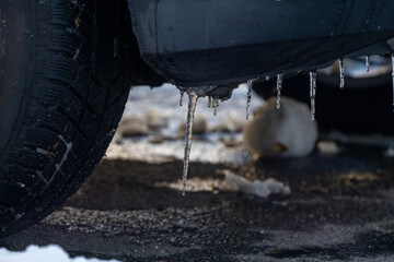Icicles Hanging from a Parked Winter Car