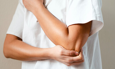 Feeling pain and stiffness of elbow joints caused 