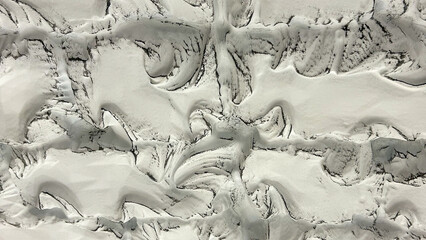 Close-up of a white textured surface with intricate, abstract patterns and subtle shadowing. Ideal for modern art concepts, minimalistic decor, and creative design backdrops.