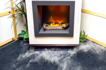 Artificial fireplace effect with ceramic logs inside home interior