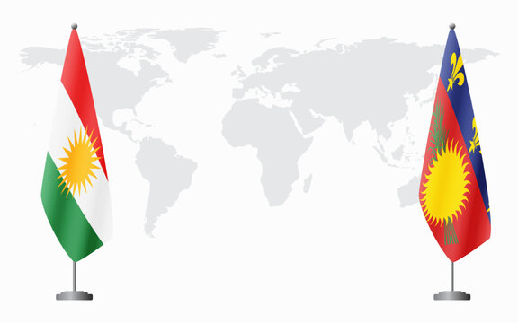 Kurdistan and Guadeloupe flags for official meeting against background of world map.