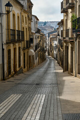 Charming narrow street in a historic European city with old architecture