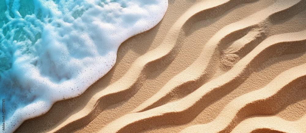 Poster Waves creating textured patterns on golden sand at the beach with gentle ocean foam and pristine shoreline for a serene landscape backdrop