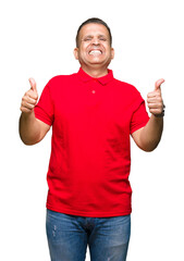 Fototapeta premium Middle age arab man over isolated background success sign doing positive gesture with hand, thumbs up smiling and happy. Looking at the camera with cheerful expression, winner gesture.