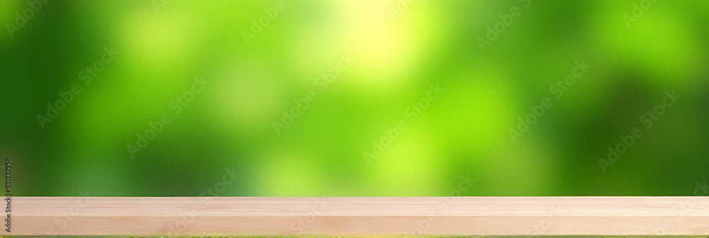 Poster a minimalist wooden table sits atop a blurred, vibrant green garden background with no visible objec