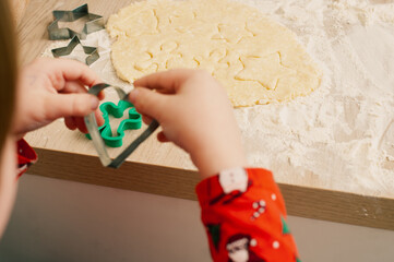 Caucasian boy crafing decorations or opening presents  at home candid shot candind shot winter holiday activities
