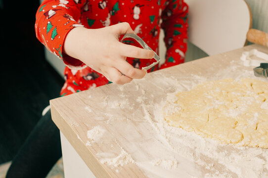 Caucasian boy crafing decorations or opening presents  at home candid shot candind shot winter holiday activities