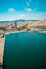 Obraz premium Aerial View of a Coastal City With Waterfront and Harbor Under a Clear Sky