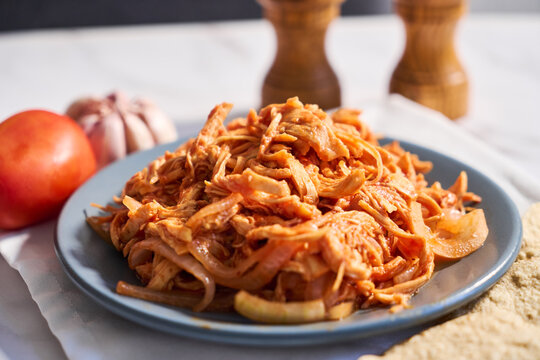 Traditional mexican chicken tinga with chipotle sauce