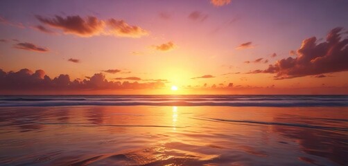 Obraz premium A kaleidoscope of warm colors bursts forth from the eastern horizon as daybreak awakens the sea, warm colors, sky