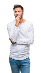 Adult hispanic man over isolated background thinking looking tired and bored with depression...