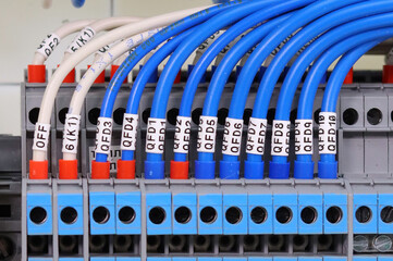 Marking of electrical wires using thermal printing on vinyl tape.