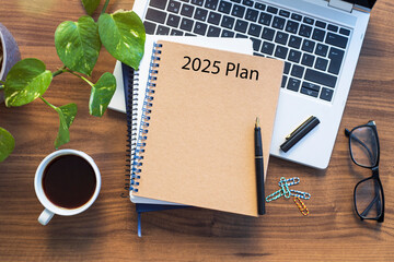 Note book with 2025 goals text on it to apply new year resolutions and plan.
