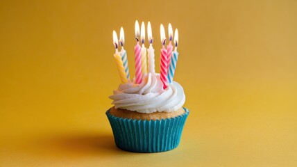 Birthday Cupcake with Multiple Lit Candles and Yellow Background
