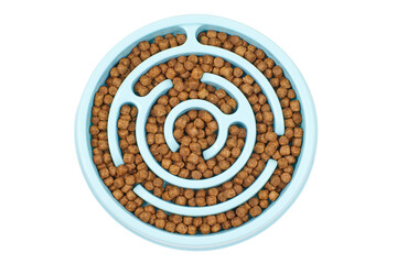 Kibble pet food in slow feeding bowl isolated on white background Slow feeder with kibble for pets. Top view 