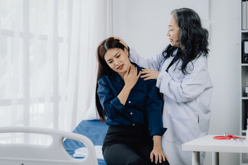 Compassionate Care: Doctor comforting a patient in a hospital room.  A moment of empathy and...