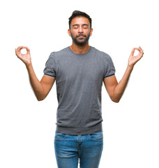 Adult hispanic man over isolated background relax and smiling with eyes closed doing meditation...