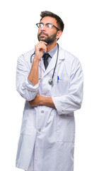 Adult hispanic doctor man over isolated background with hand on chin thinking about question,...