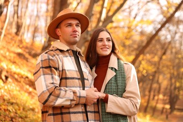 Fototapeta premium Happy couple spending time together in autumn park