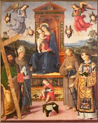 Fototapeta premium Spello - The painting of Madonna with saints in the church Chiesa di San Andrea by Pinturicchio (1454 - 1513) and Eusebio da San Giorgio and Giovanni di Franceso.