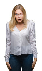 Fototapeta premium Young caucasian woman over isolated background afraid and shocked with surprise expression, fear and excited face.