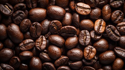 Fototapeta premium Close-up of roasted coffee beans on dark textured surface