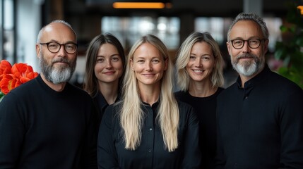 Fototapeta premium Five individuals smile together indoors, showcasing their diverse styles and friendly demeanor