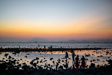 Sunset Silhouette at Rocky Shoreline