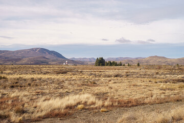 Naklejka premium San Carlos de Bariloche, Rio Negro province, Argentina - May 11th, 2023 - Fields near the airport.
