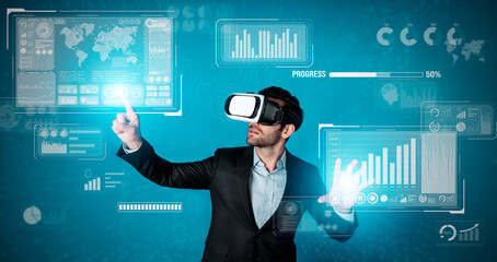Skilled business man looking data analysis while planning strategy by using visual reality glasses. Professional smart investor checking financial graph holographic while wearing VR goggle. Deviation.