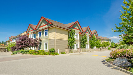 Modern apartment building with nice summer landscape in Vancouver, Canada, North America. Day time...