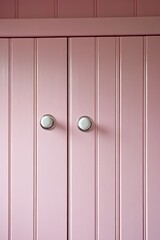 Obraz premium Pink Wooden Cabinet Doors With White Knobs