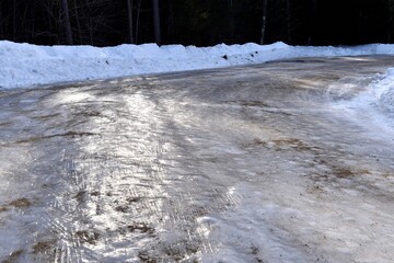 Driveway or road covered in a thick sheet of ice