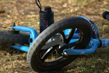 children's bike laying on grass