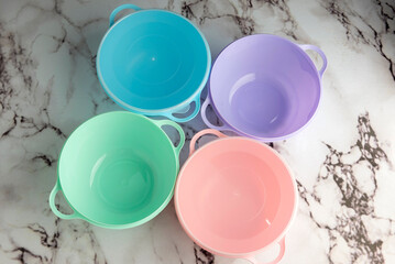 Multipurpose plastic food containers for vegetables, meats, cheeses on a kitchen counter