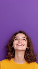 Fototapeta premium beautiful girl beautiful young woman smiling on purple background with copy space vertically 9:16